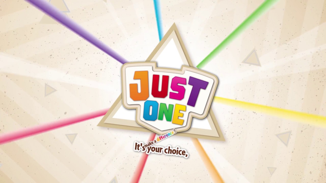 Der Karton ist beige und in der Mitte steht mit bunten Buchstaben “Just One”. Vom Schriftzug gehen bunte Strahlen nach außen.